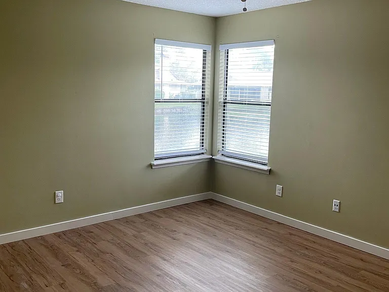 Master Bedroom. Water view through windows, Wood plank flooring