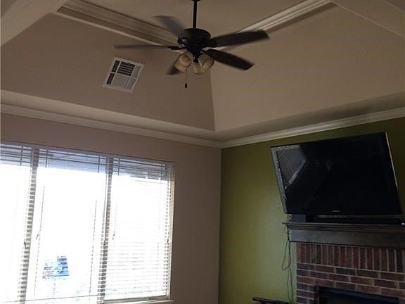 Wood tile in living room! Crown molding! Fireplace!