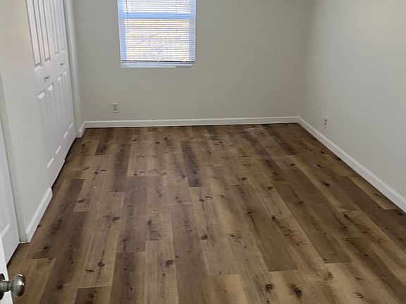 Ceiling fan in bedroom with double closets