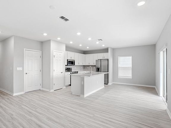 Downstairs, enjoy a welcoming, open-concept living area - Blakely by Highland Homes