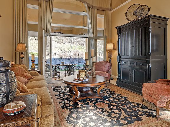 An open & inviting Great Room with French Doors to Patio