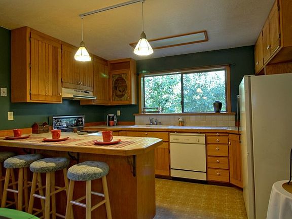 Roomy kitchen with quality cabinets and breakfast bar.