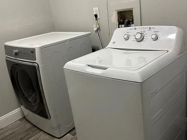 Dedicated laundry area with full-size washer and dryer and durable flooring for easy, convenient wash days.