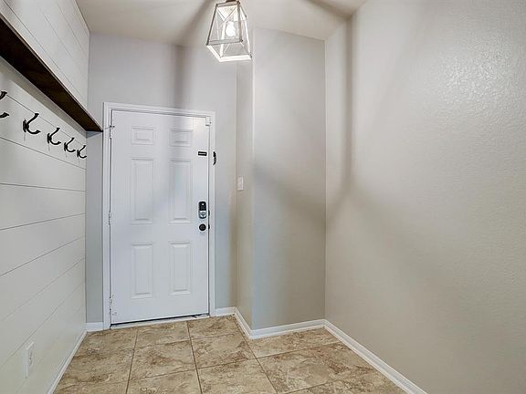 Spacious living room open to kitchen. Down stairs primary bedroom