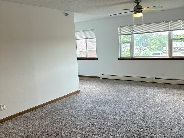 living room area with den off to the side