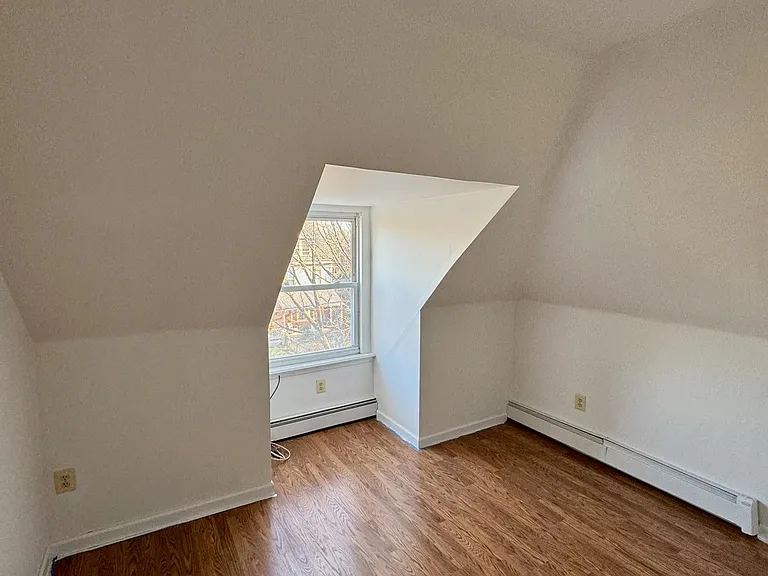 Bedroom w/ luxury vinyl flooring