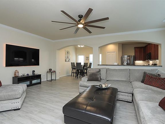 Downstairs is pretty wood look tile throughout and an open plan with high ceilings.