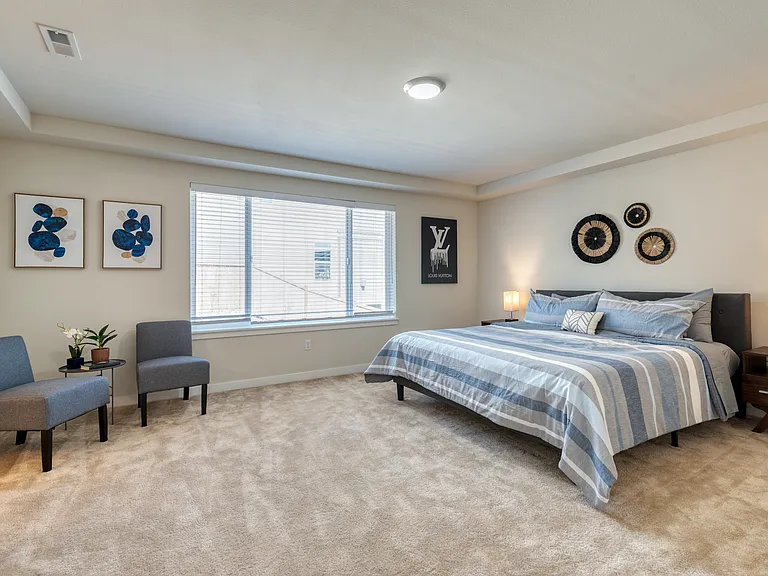 Oversize, Primary Bedroom with King Bed and Accent chairs to lounge and read.