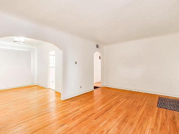 Living room and dining room (UPDATED PICTURE COMING SOON - New fixtures, paint, and tile flooring in hallway!)