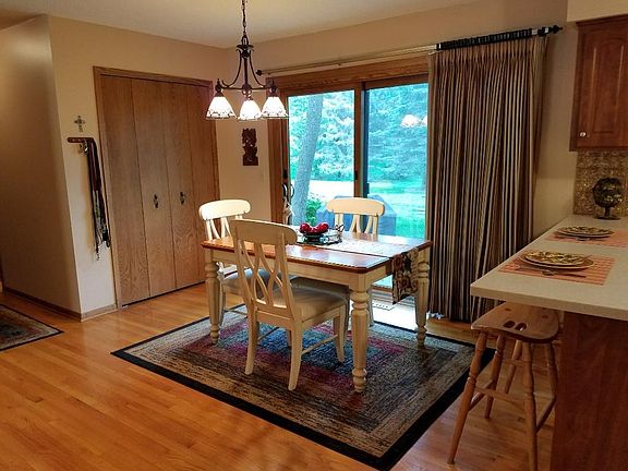 A dining room off the kitchen with a new slider to the patio in back offering great views.