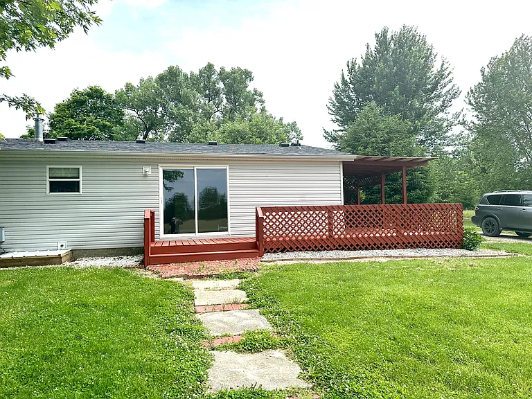 Deck on back and side of house.