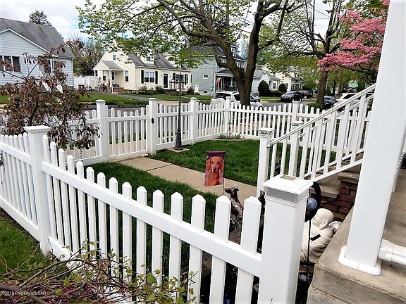 Front yard fenced for the fur babies