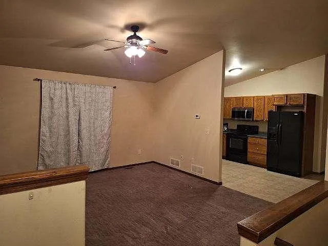 Inside front door/Living room - 221 Dakota Trl