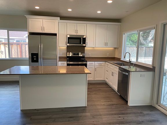 Kitchen and Island - Newly remodeled and all NEW electric appliances. New flooring and paint too