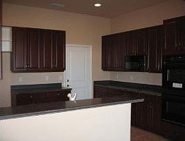 Cherrywod kitchen w/double oven glass cooktop built in micro corian counters 