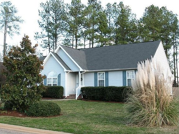 Facing south, looking at the north side of the house from the front