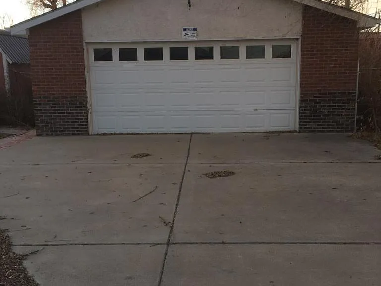 Oversized 2-car garage in back. Features workbench, chest freezer, side door entry, lots of room!