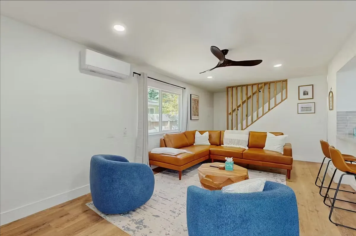 Cozy modern living room with a large screen TV - 685 Clement St