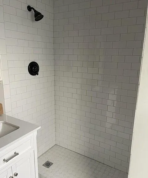 Glass shower door will be installed, updated water pressure