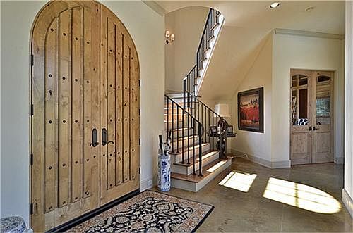 The heavy birch doors are the first clue for what is in store for the rest of this gorgeous home in Carlton Woods.