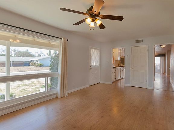 The gorgeous flooring and freshly painted walls are complimented by the amazing natural light that fills the family room.