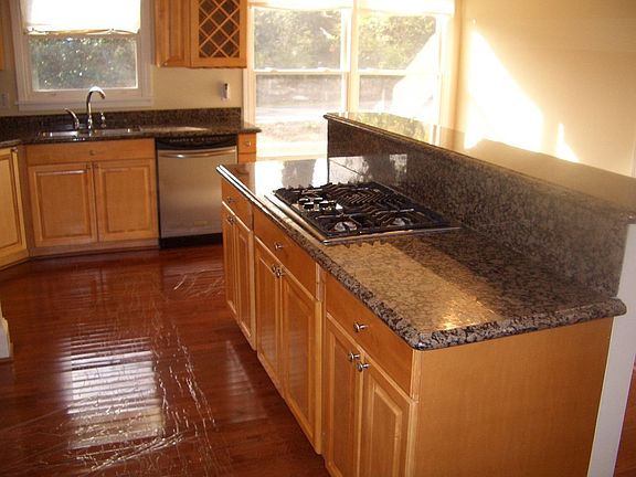 Granite counters, chef's island, stailness steel appliances, breakfast nook 