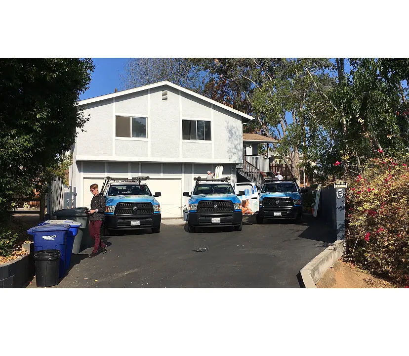 Front of Triplex -shows American Vision windows installing all new double pane windows and patio sliders.