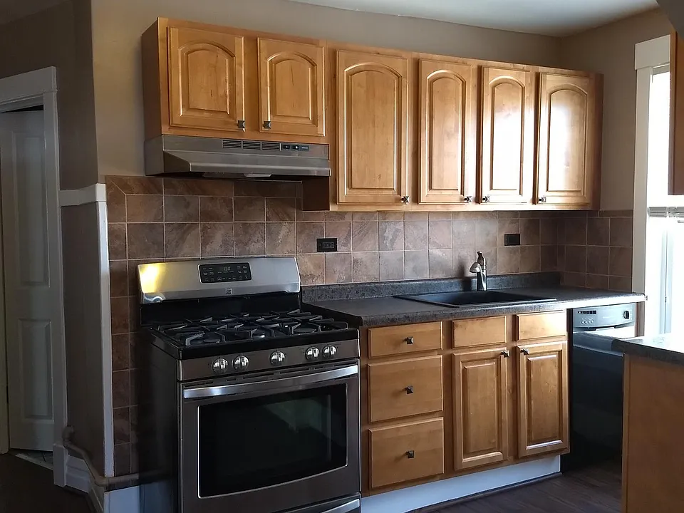 New kitchen with cherry cabinets.