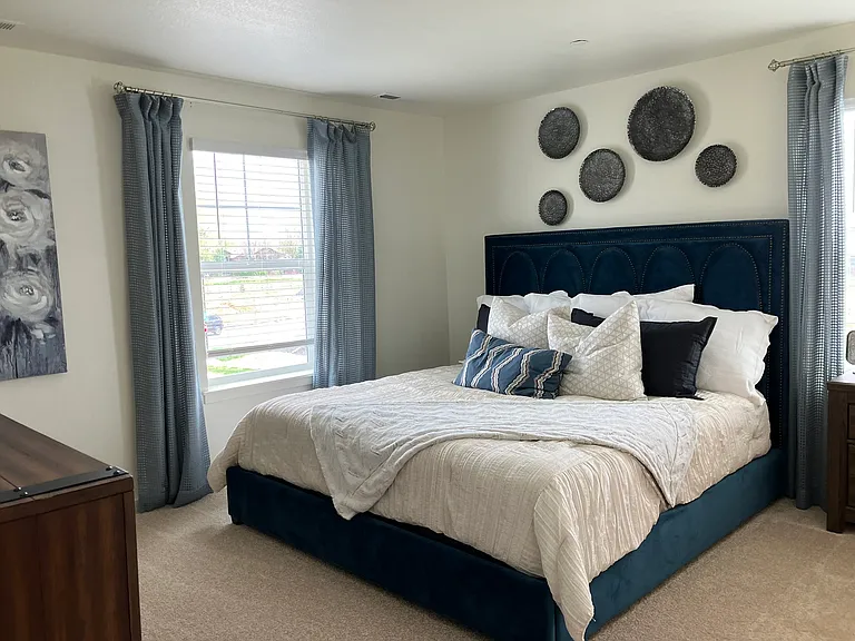 Sample of same floor plan, different finishes, staged with furniture.