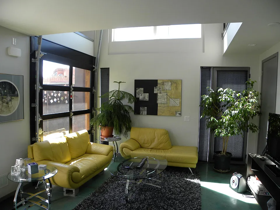 Living Room. Unit has a front door and a side door behind a gate.