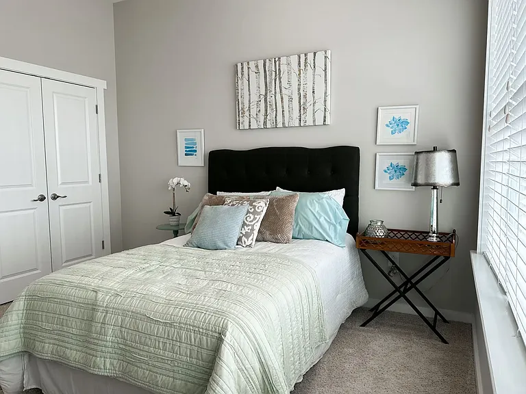 Shown here, is the bedroom of an Emeline floorplan, which includes a double door closet.