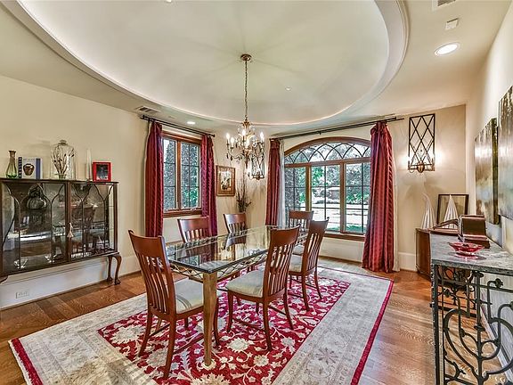Spacious family room surrounds a Rumford fireplace and provides the perfect gathering space for family and friends.