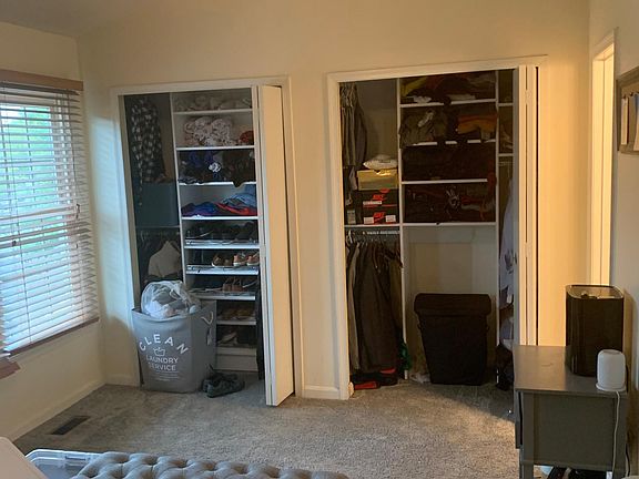 Master bedroom with custom closet design and en suite bathroom