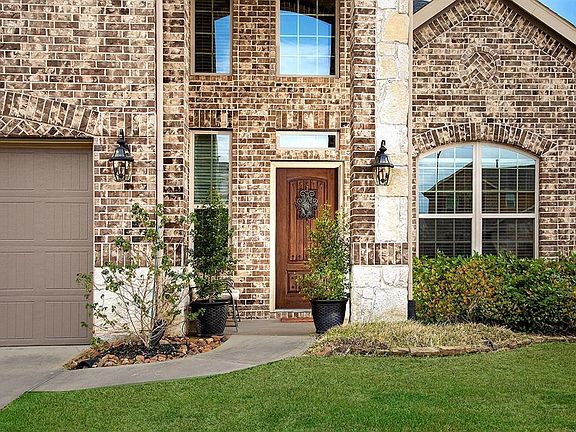 An oversize garage offers plenty of room for parking and storage...