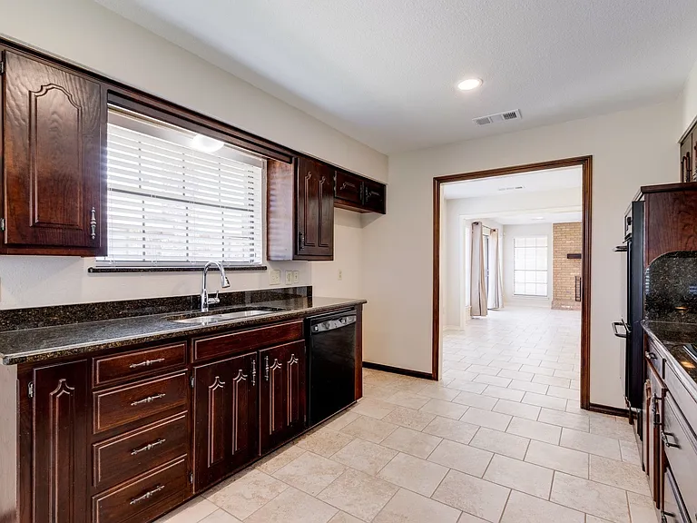 Recessed lighting, lots of cabinets, and lots of counter space.