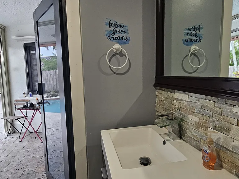 Guest bathroom with pool access