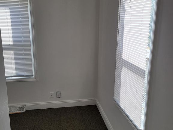 Lower level living room that can be converted into 4th bedroom.