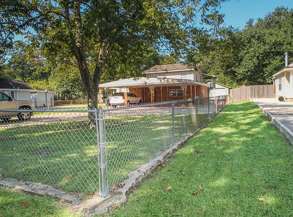Large fenced yard in front