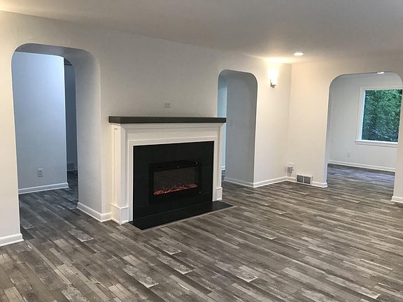 Entry/Living room with cozy electric fireplace