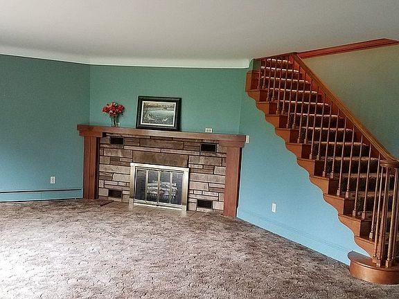 Open stairway and fireplace!