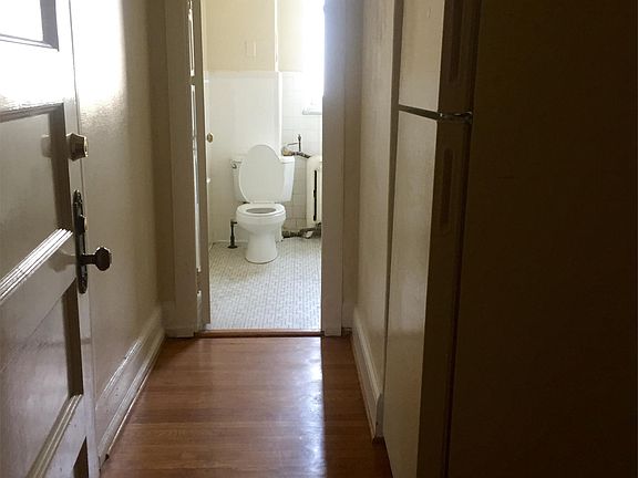 Entry view. Bedroom on the left. Full size fridge remains.