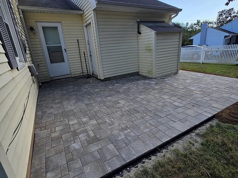 Newly installed patio accessible from the kitchen. Gret for outdoor actitives, grilling and relaxiation.
