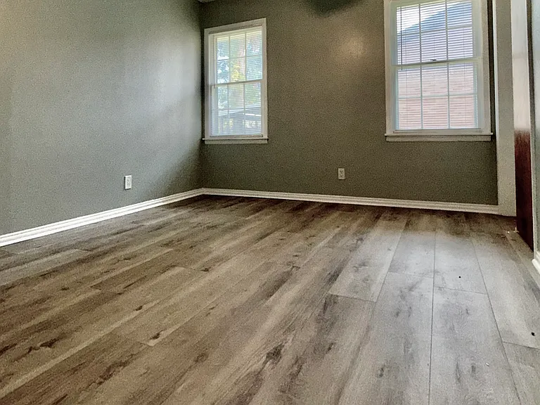 The master bedroom facing the back covered deck.