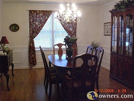 Exquisite and large dining room with wood flooring