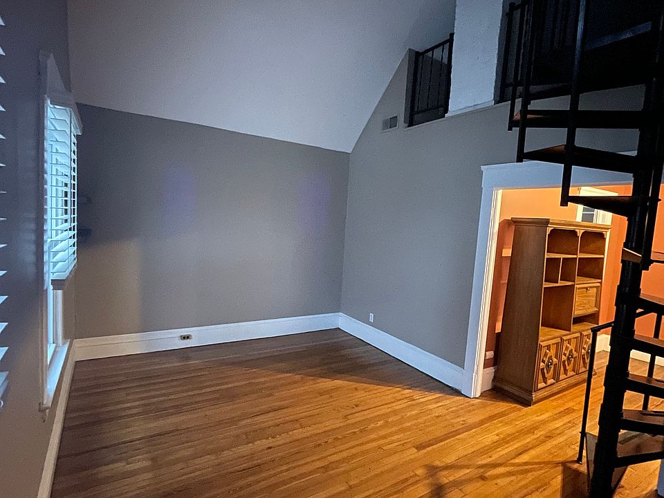 Spacious living room with all new blinds.