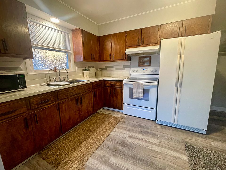 Well-appointed kitchen offering the space and functionality needed for comfortable extended stays, complete with a dedicated coffee bar.