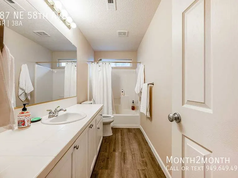 487 NE 58th Ave — Photo 22