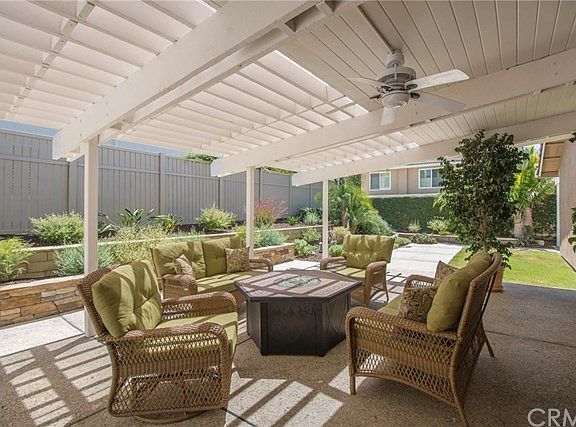 Covered patio with fan, newly landscaped