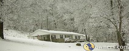 View from road up driveway toward front