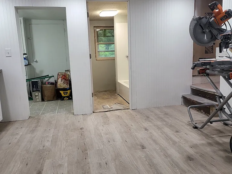 Kitchen, laundry room entrance on left , bathroom on right
